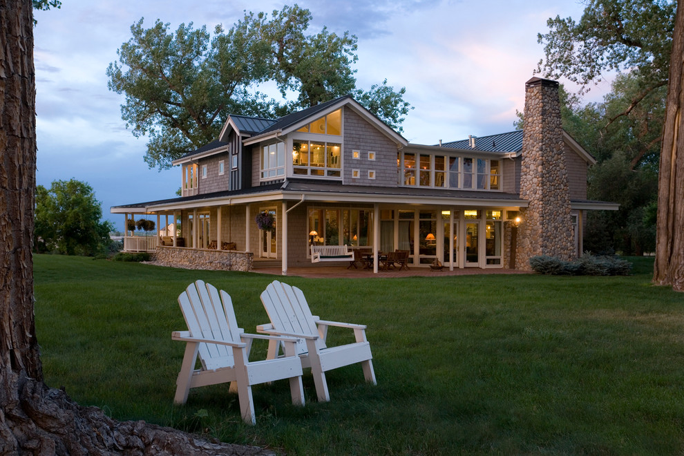 Example of a classic two-story exterior home design in Denver
