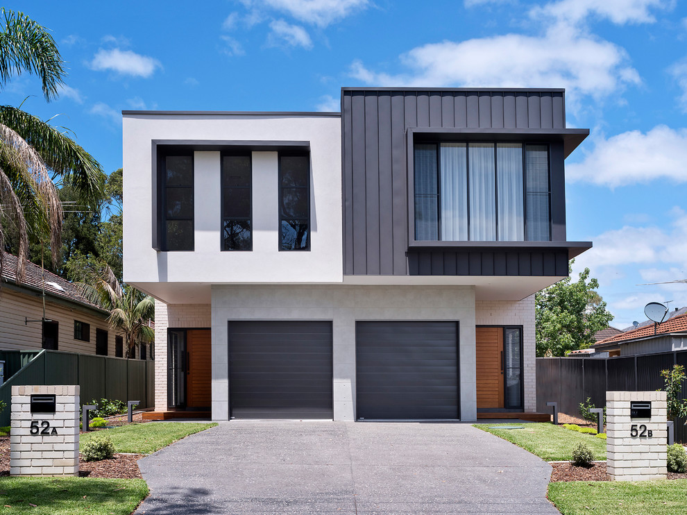 Zweistöckige Moderne Doppelhaushälfte mit Mix-Fassade, bunter Fassadenfarbe und Flachdach in Sydney
