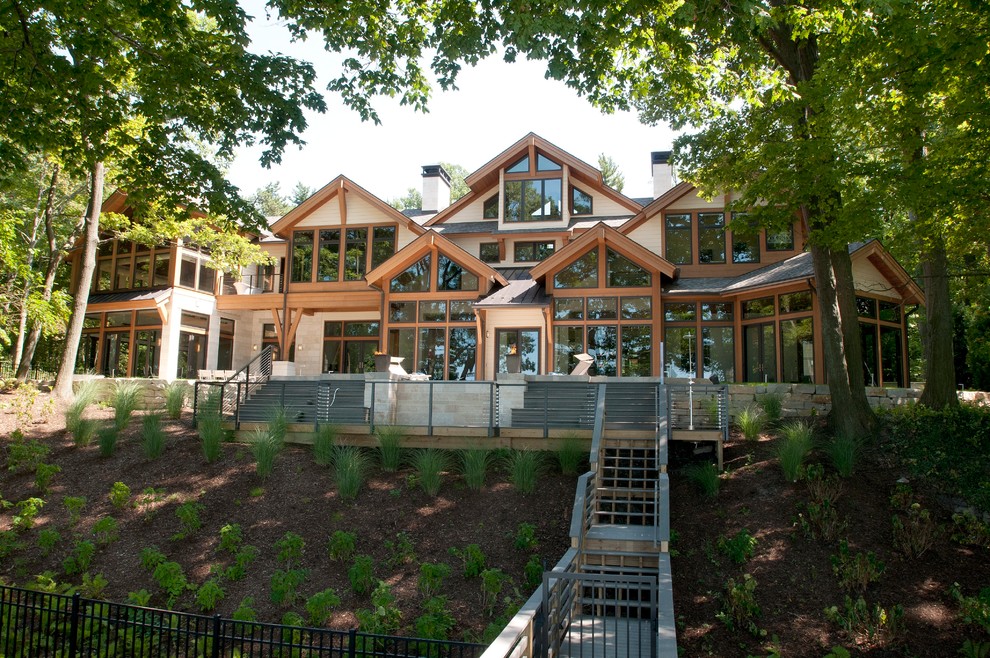 This is an example of a large and white contemporary house exterior in Grand Rapids with three floors.