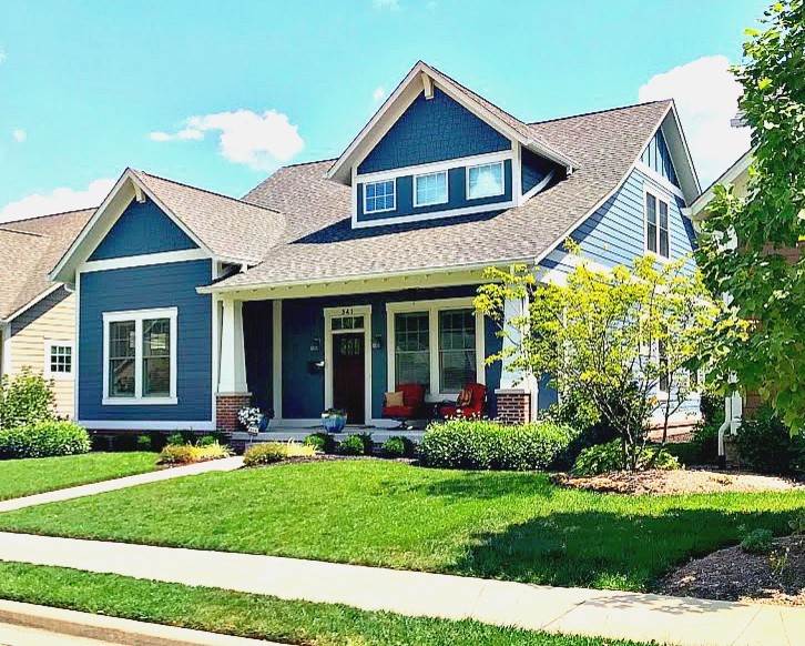 Inspiration for a small and blue traditional two floor house exterior in Indianapolis with wood cladding, a pitched roof and a shingle roof.