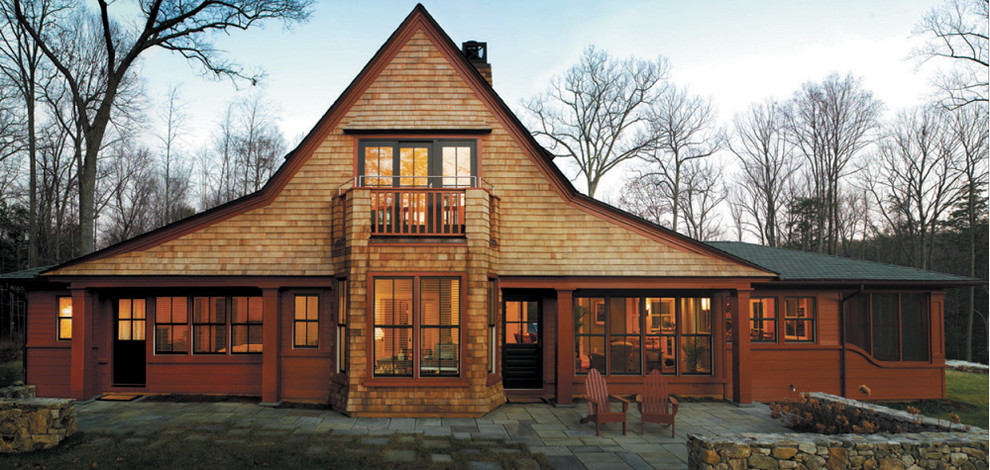 Inspiration for a rustic house exterior in Providence with wood cladding.