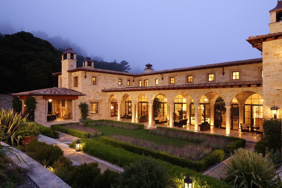 Tuscan two-story stone exterior home photo in San Francisco