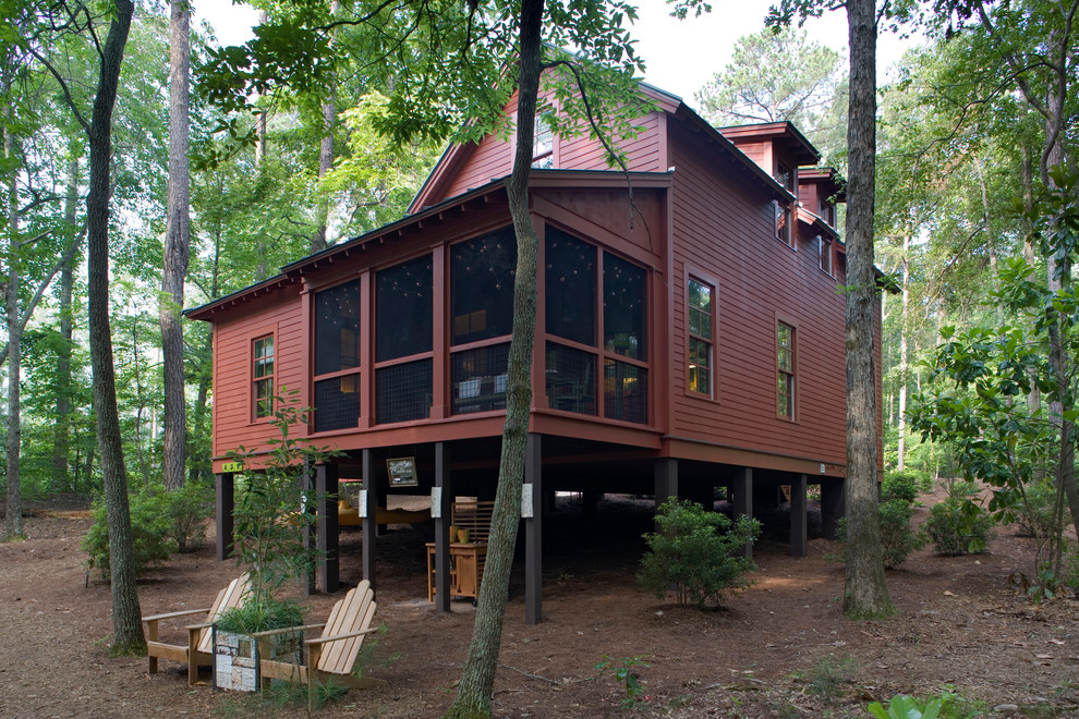 Mountain style red two-story wood exterior home photo in Atlanta