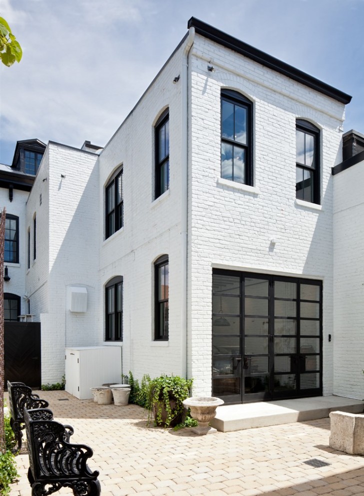 Design ideas for a white urban brick house exterior in DC Metro with three floors and a flat roof.