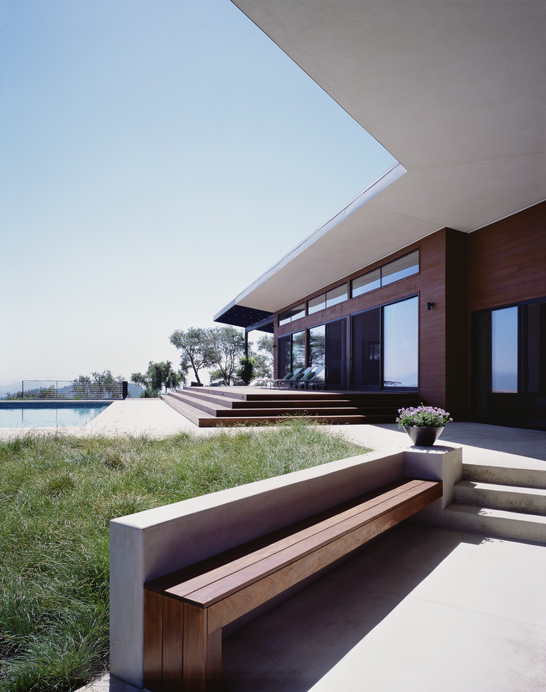 Inspiration for a modern house exterior in San Francisco with wood cladding.