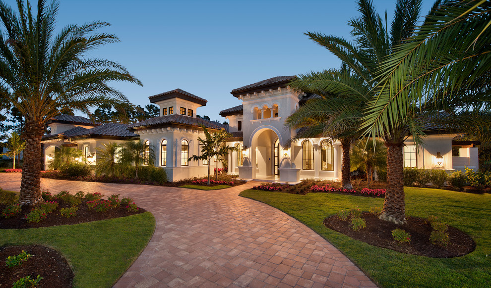Inspiration for a large and beige contemporary bungalow house exterior in Miami.