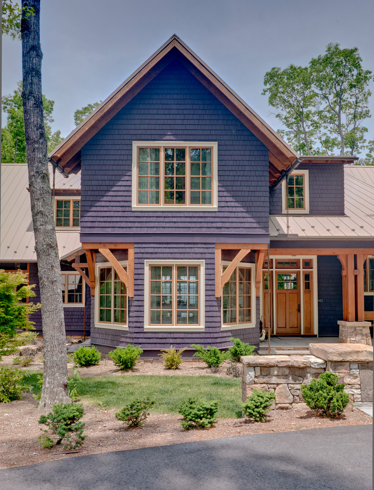 Large transitional blue two-story wood exterior home idea in Other