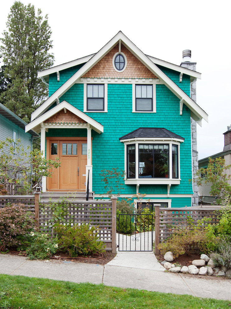 Victorian multicolored three-story wood exterior home idea in Vancouver