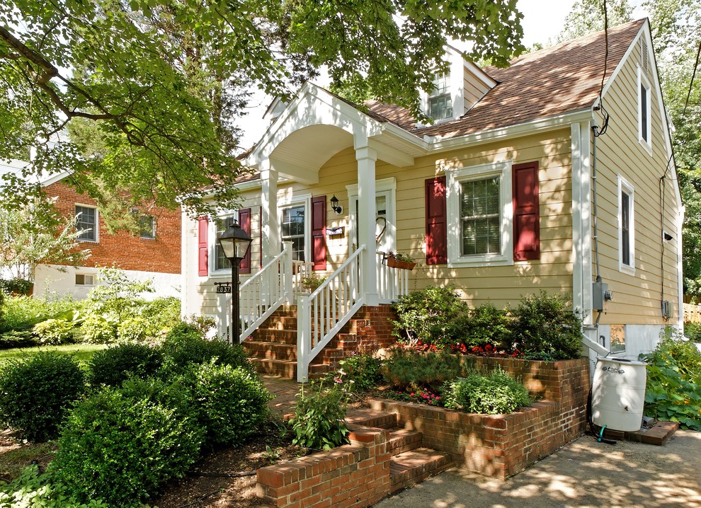 Photo of a classic house exterior in DC Metro with wood cladding.