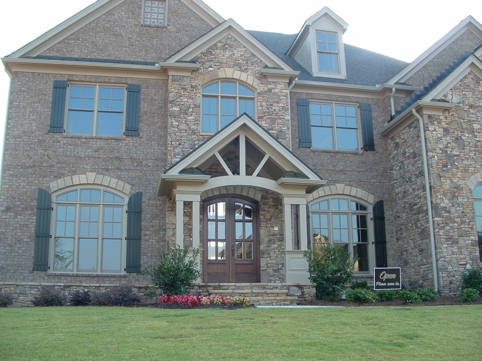 Traditional two floor house exterior in Atlanta with stone cladding.