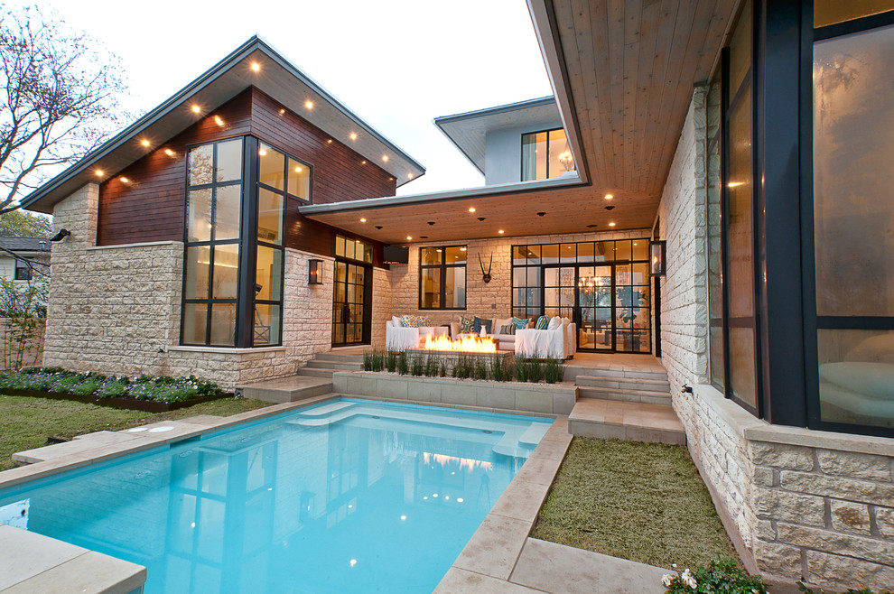 Contemporary stone exterior home idea in Austin