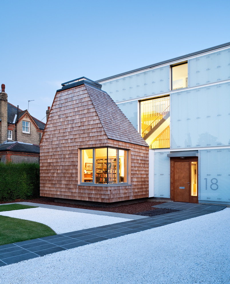 Inspiration for a contemporary house exterior in London with mixed cladding.