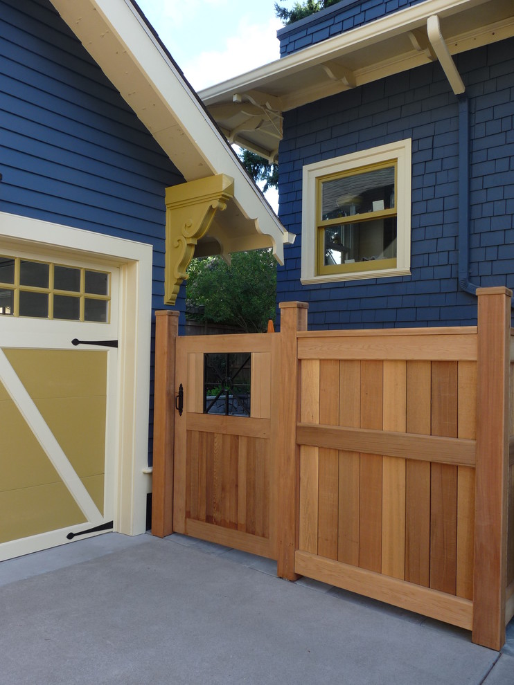 Photo of a blue and medium sized traditional two floor house exterior in Portland with wood cladding.