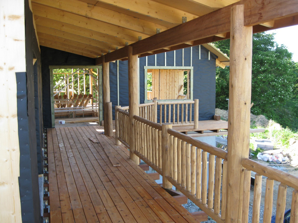 Cedar deck posts and cedar railing Rustic Exterior Other by