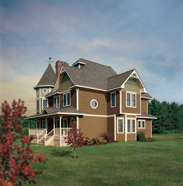 Réalisation d'une façade de maison rouge victorienne de taille moyenne et à deux étages et plus avec un revêtement en vinyle.