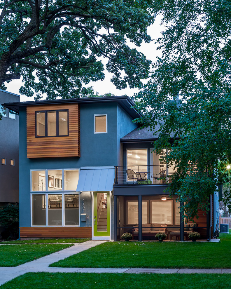 Design ideas for a blue contemporary house exterior in Minneapolis with three floors.