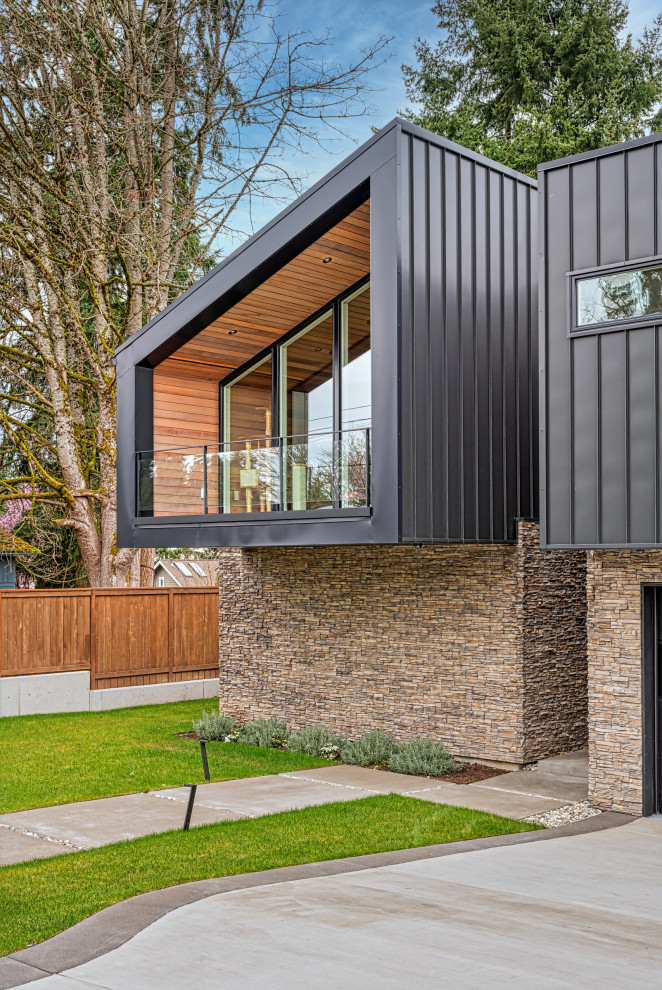 Photo of a medium sized contemporary two floor detached house in Seattle with mixed cladding.