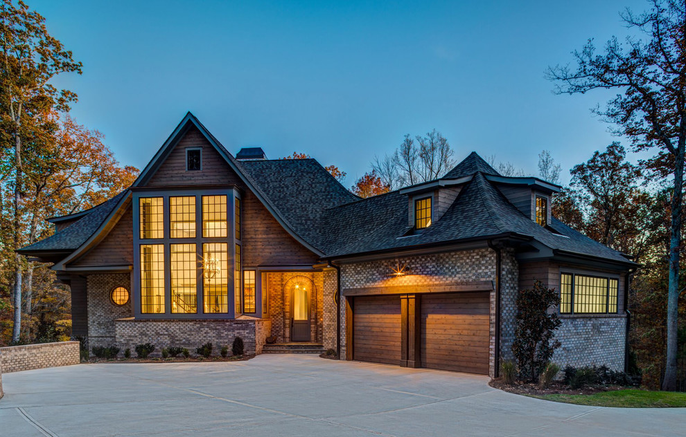 Expansive rustic detached house in Charlotte with three floors and wood cladding.