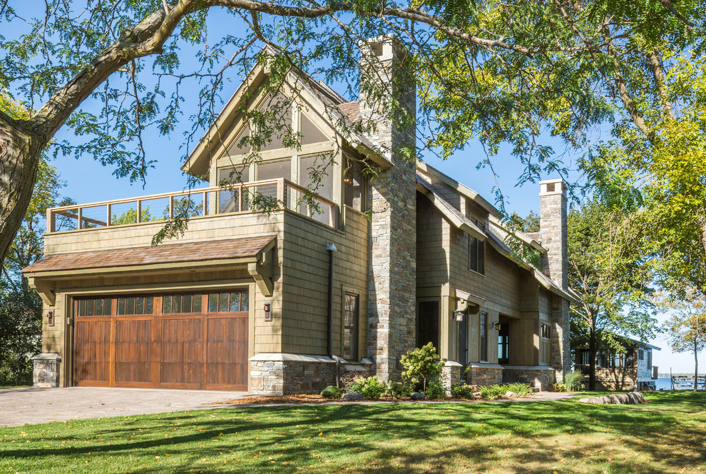 Inspiration for a mid-sized rustic green two-story wood exterior home remodel in Minneapolis