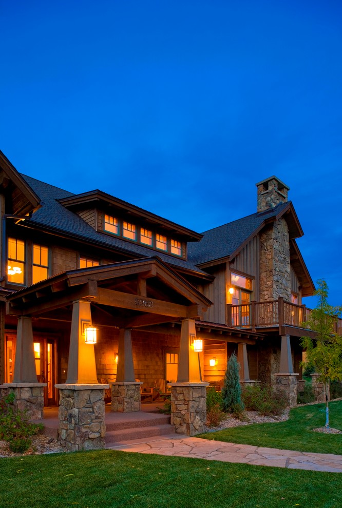 Design ideas for a large and brown rustic two floor house exterior in Denver with wood cladding.