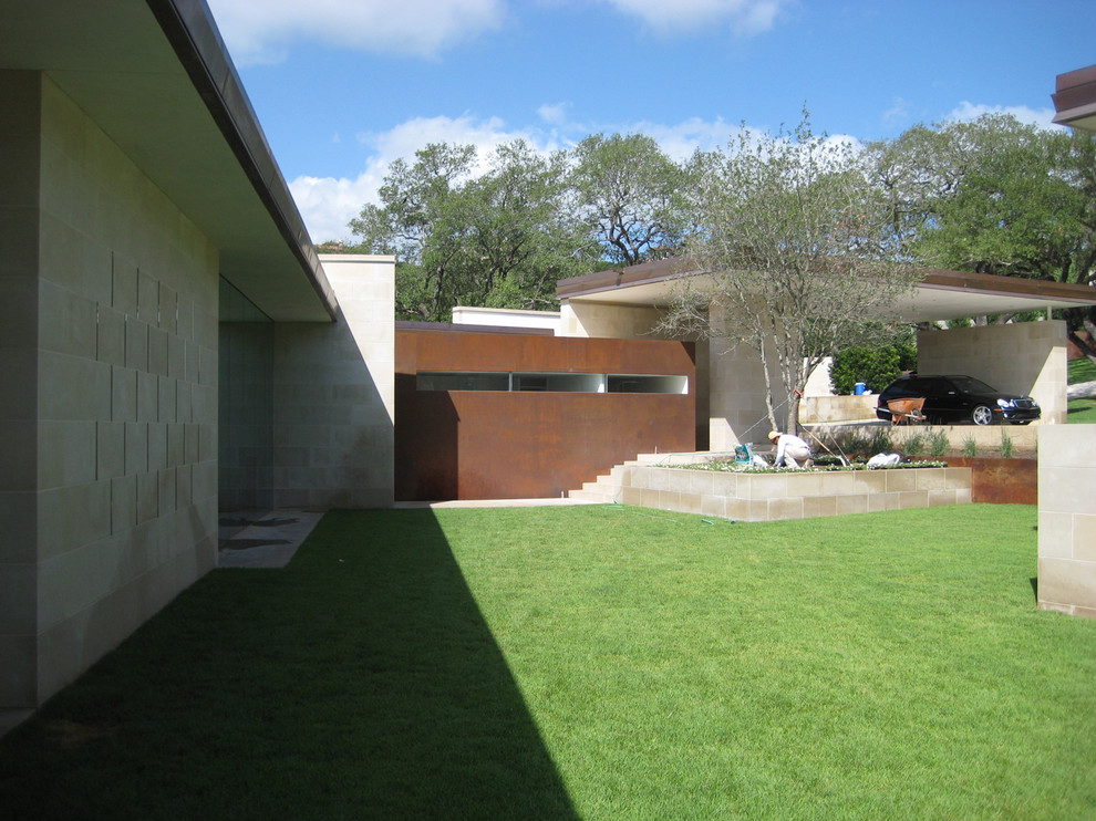 Inspiration for a large modern one-story concrete exterior home remodel in Austin