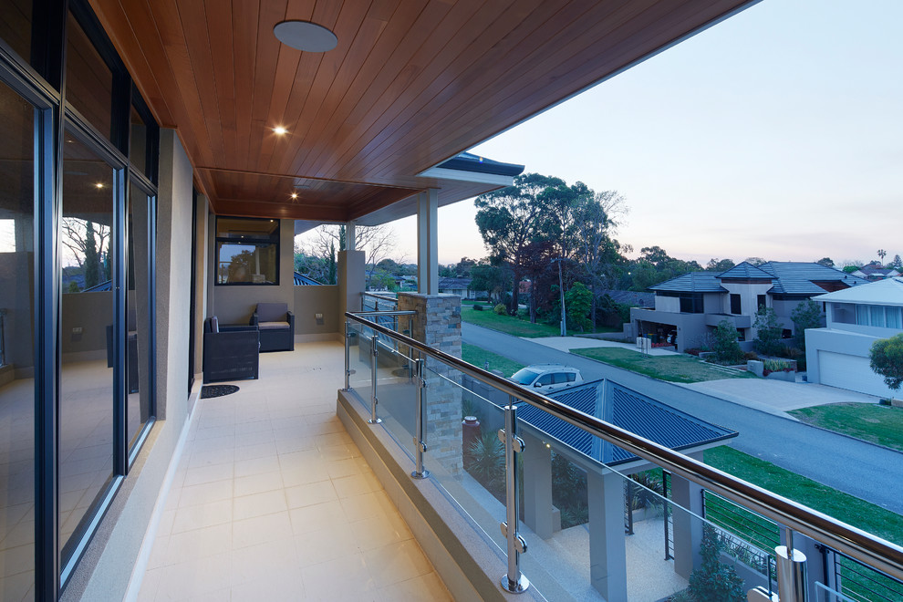 Inspiration for a large contemporary beige three-story exterior home remodel in Perth