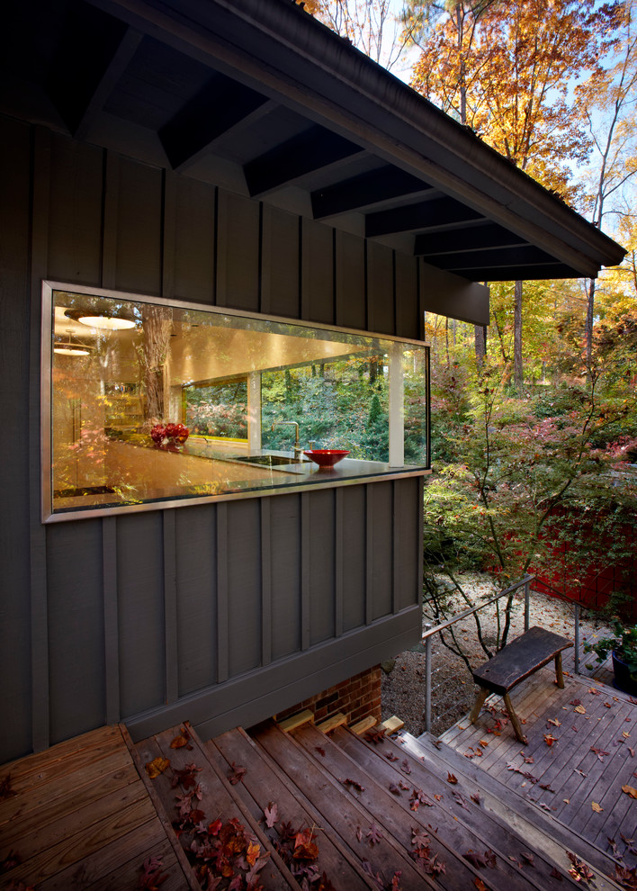 Example of a trendy metal exterior home design in Raleigh