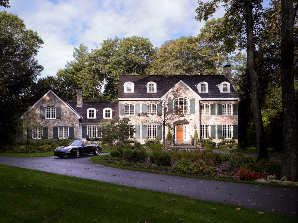 Mid-sized elegant two-story stone exterior home photo in Boston
