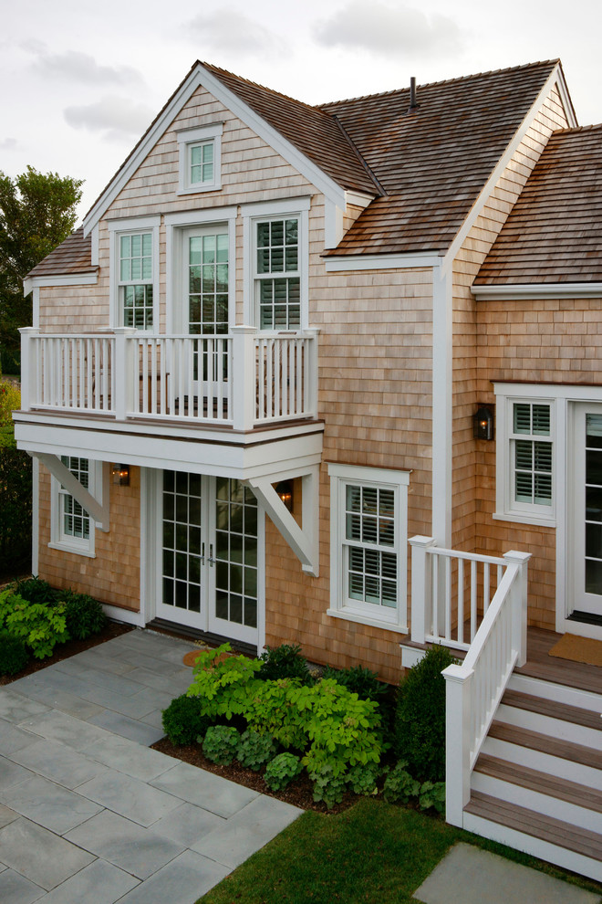 Large transitional brown two-story wood exterior home idea in Boston