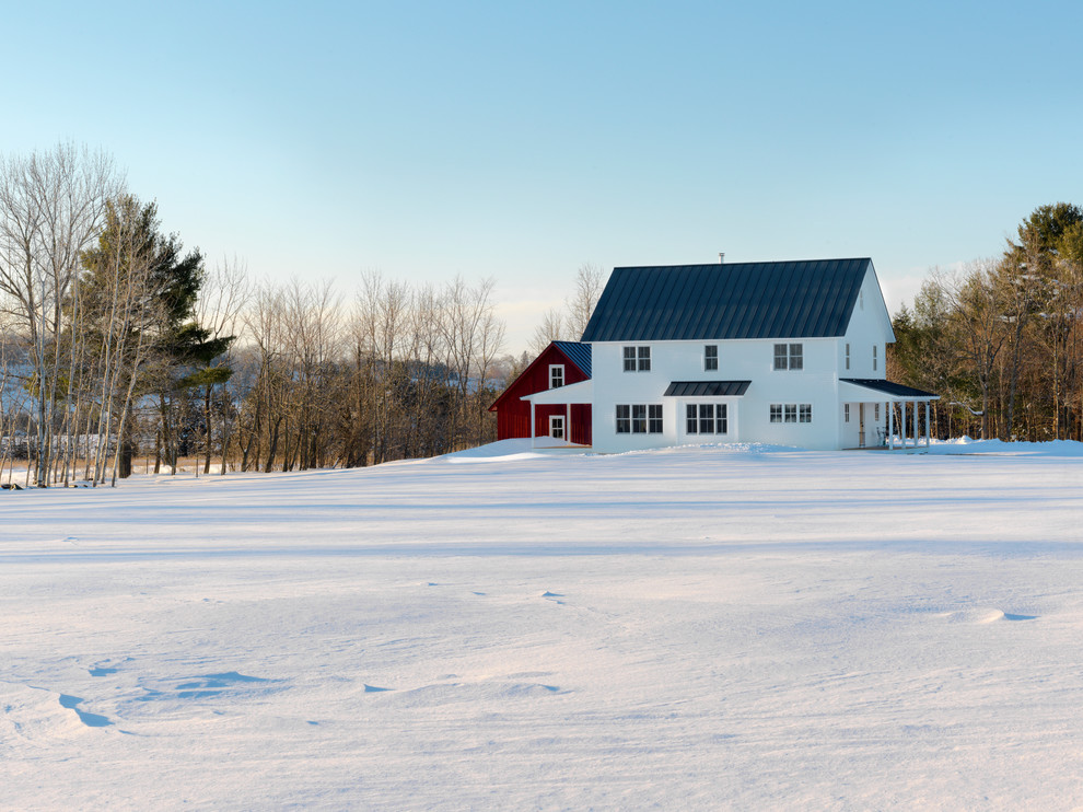 Example of a country white two-story exterior home design in Burlington