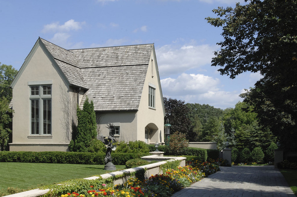 Example of a small classic two-story gable roof design in Minneapolis with a shingle roof