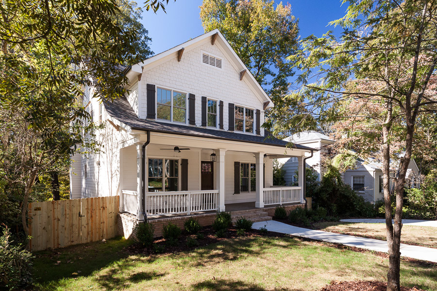 Example of a mid-sized classic white two-story wood exterior home design in Atlanta with a shingle roof