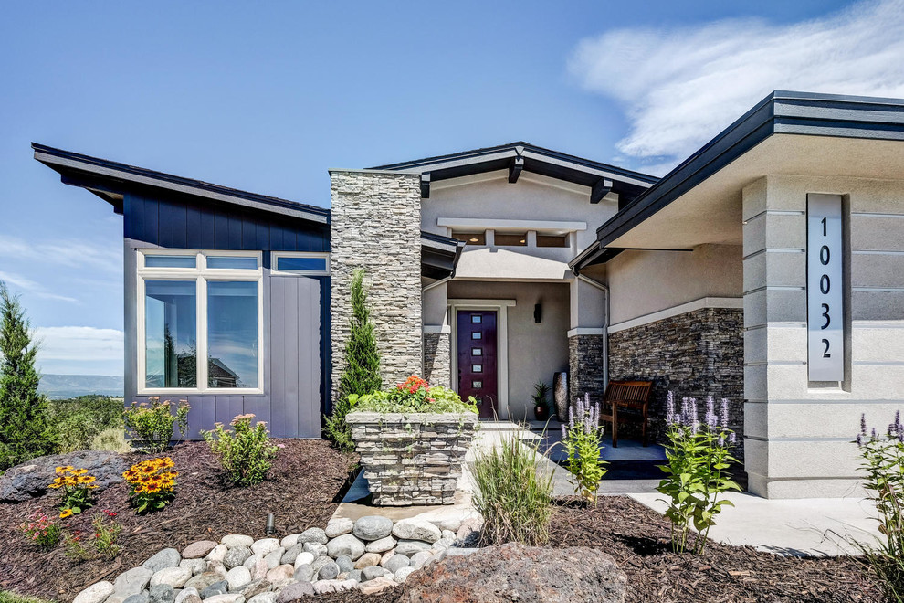 Design ideas for a contemporary house exterior in Denver with mixed cladding.