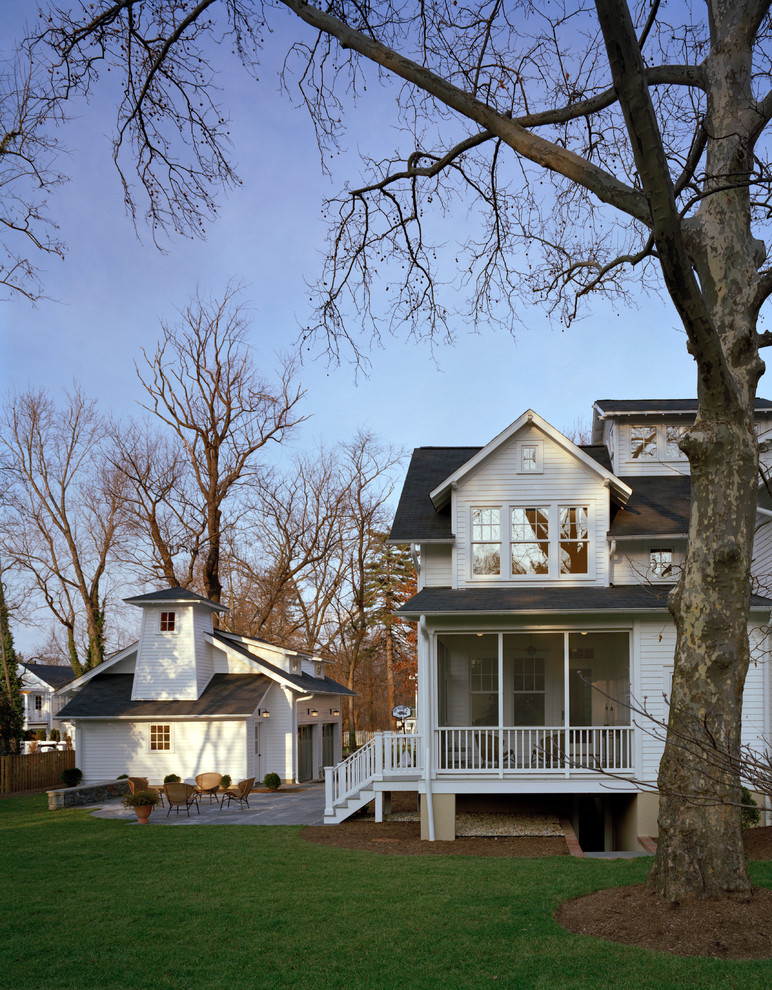 Inspiration for a timeless white two-story wood gable roof remodel in DC Metro