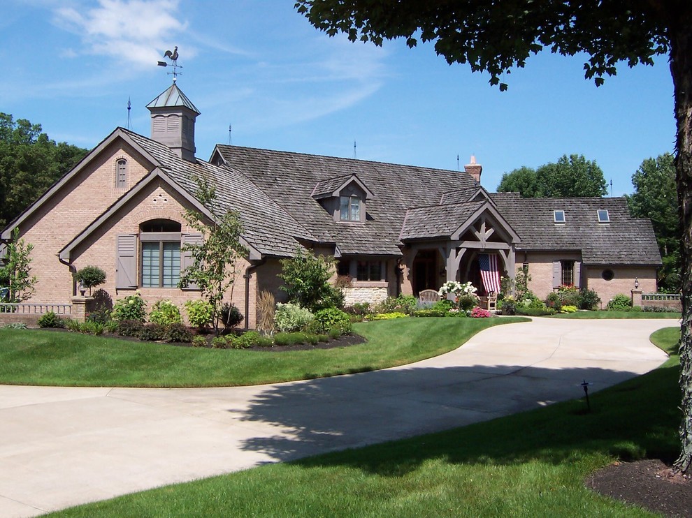Design ideas for a rustic house exterior in Cleveland.