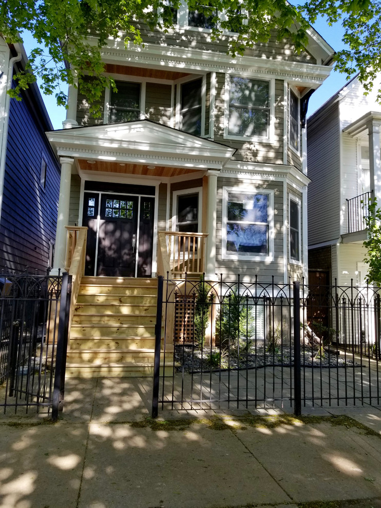 シカゴにある中くらいなヴィクトリアン調のおしゃれな家の外観 (コンクリート繊維板サイディング) の写真