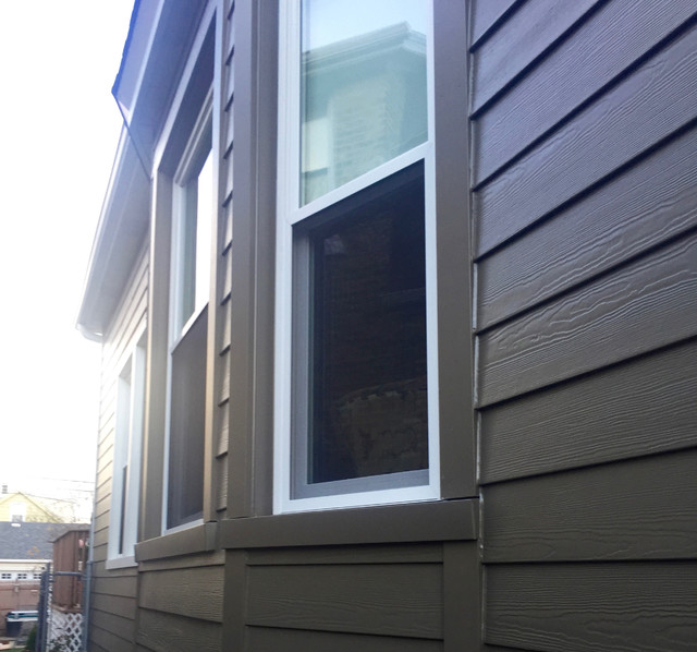 Chicago, IL Bungalow Siding Replacement with Dark Brown Siding