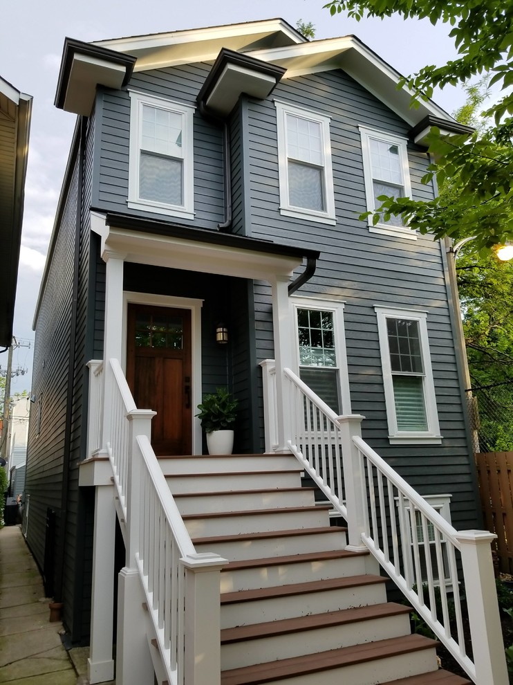 Photo of a medium sized and gey victorian detached house in Chicago with three floors, concrete fibreboard cladding, a pitched roof, a shingle roof, a brown roof and shiplap cladding.