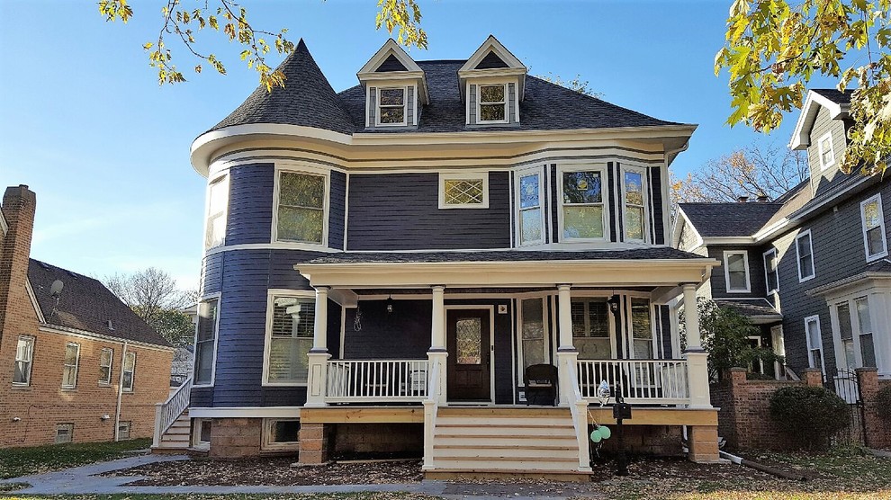 Large victorian gray three-story wood gable roof idea in Chicago