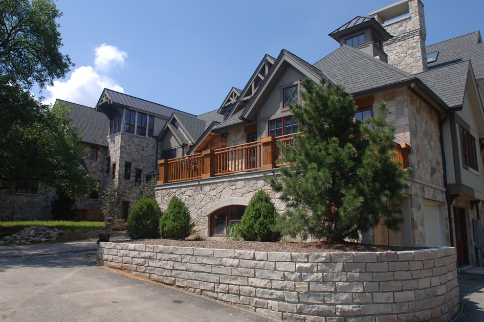 Inspiration for a house exterior in St Louis with stone cladding.