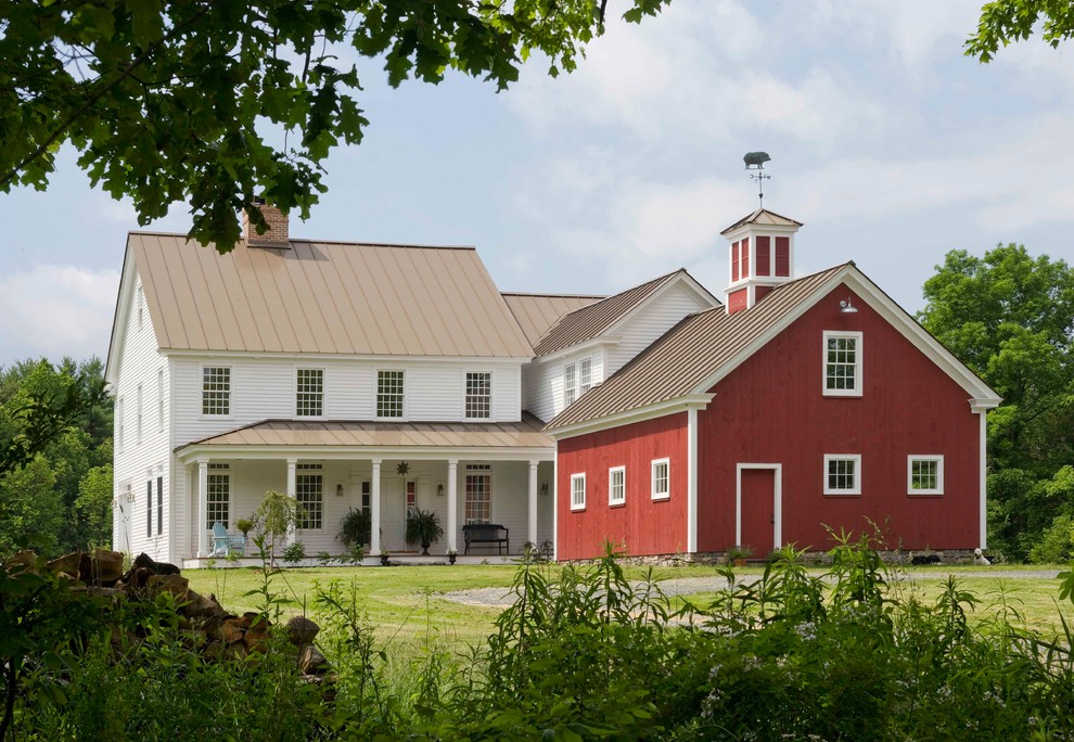 Inspiration for a farmhouse red two-story gable roof remodel