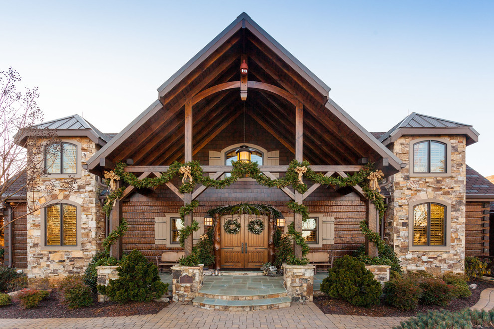 Inspiration for a large rustic brown wood house exterior remodel in Atlanta