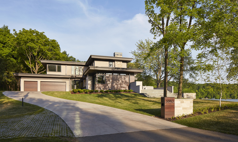 Zweistöckiges Modernes Einfamilienhaus mit grauer Fassadenfarbe und Pultdach in Minneapolis