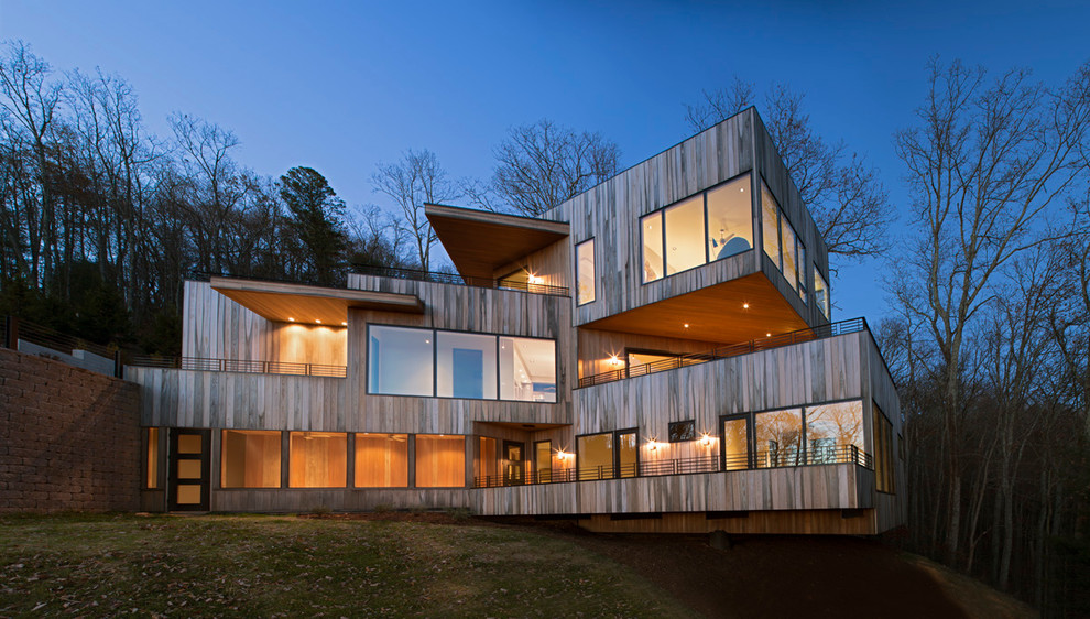 Idee per la facciata di una casa grande beige contemporanea a tre piani con rivestimento in legno e tetto piano