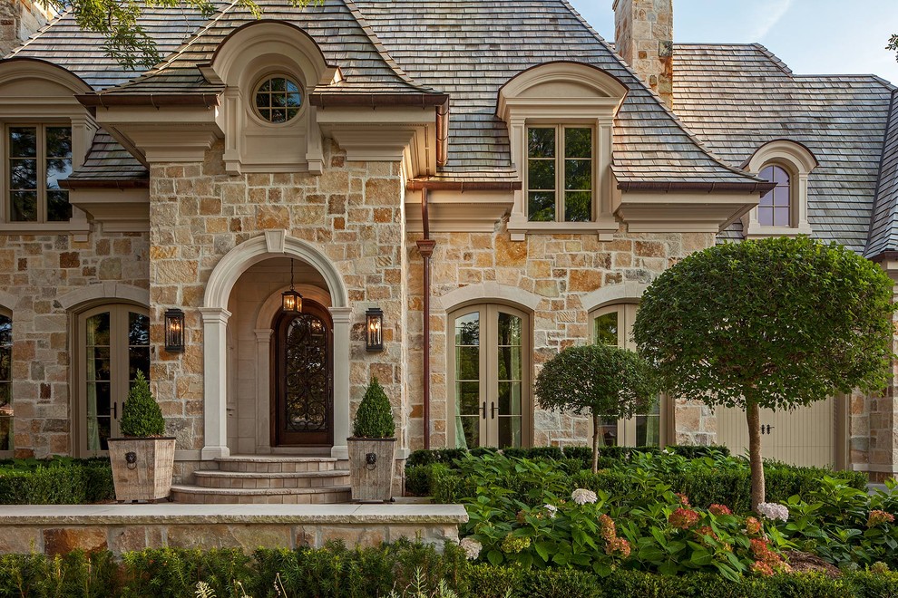 Inspiration for a classic two floor house exterior in Toronto with stone cladding.