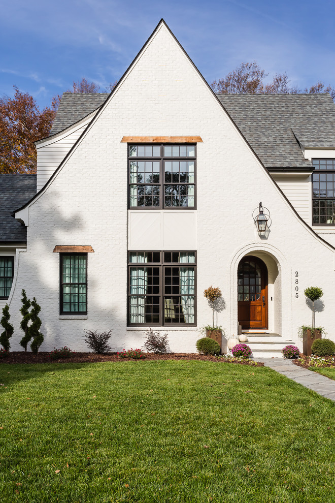 Inspiration for a mid-sized transitional white two-story exterior home remodel in Raleigh