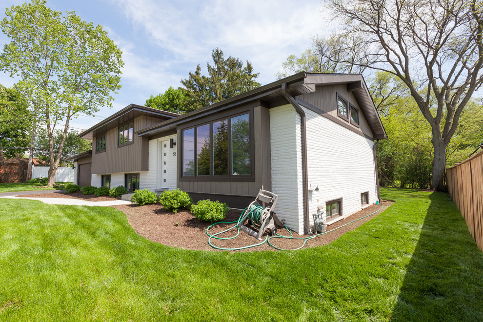 1950s beige split-level exterior home idea in Chicago