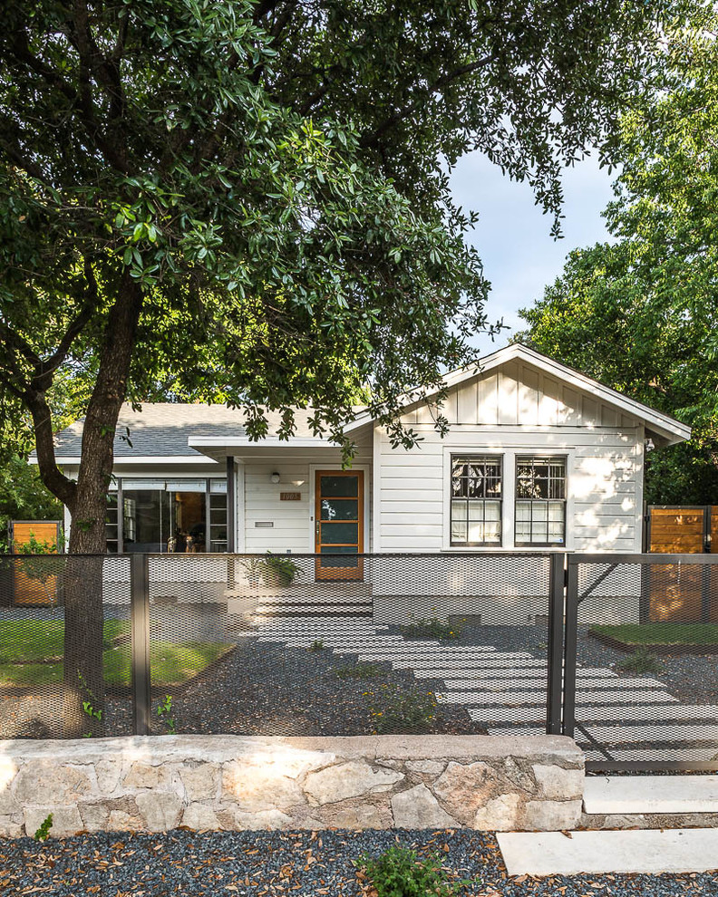 Example of a mid-sized transitional exterior home design in Austin