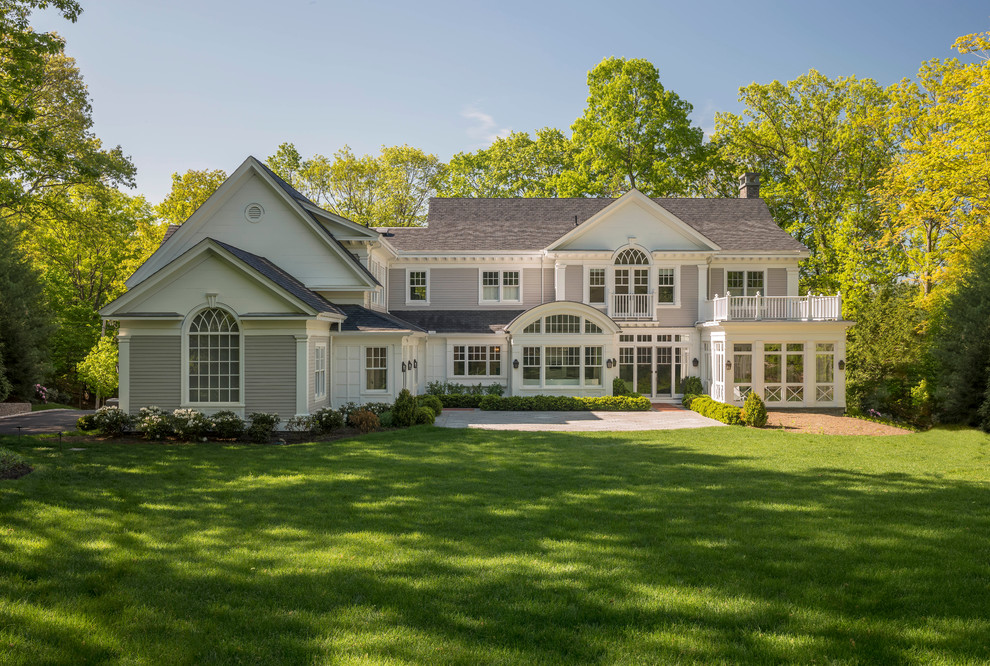 Huge elegant beige two-story exterior home photo in Boston