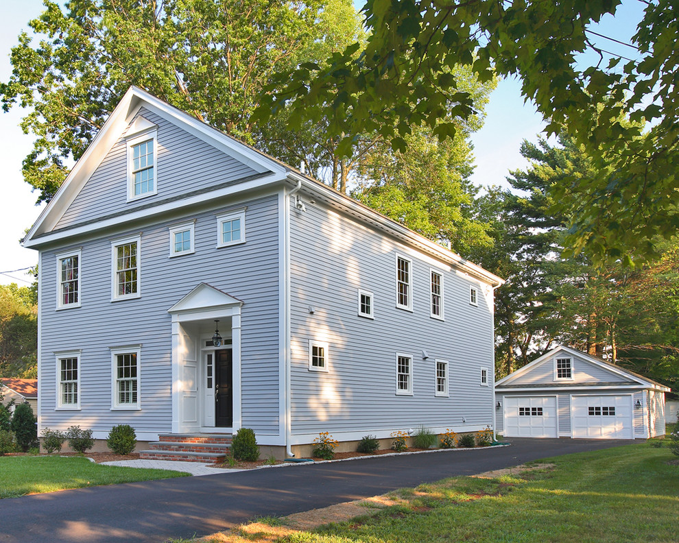 Example of a mid-sized classic gray three-story wood exterior home design in Bridgeport with a shingle roof